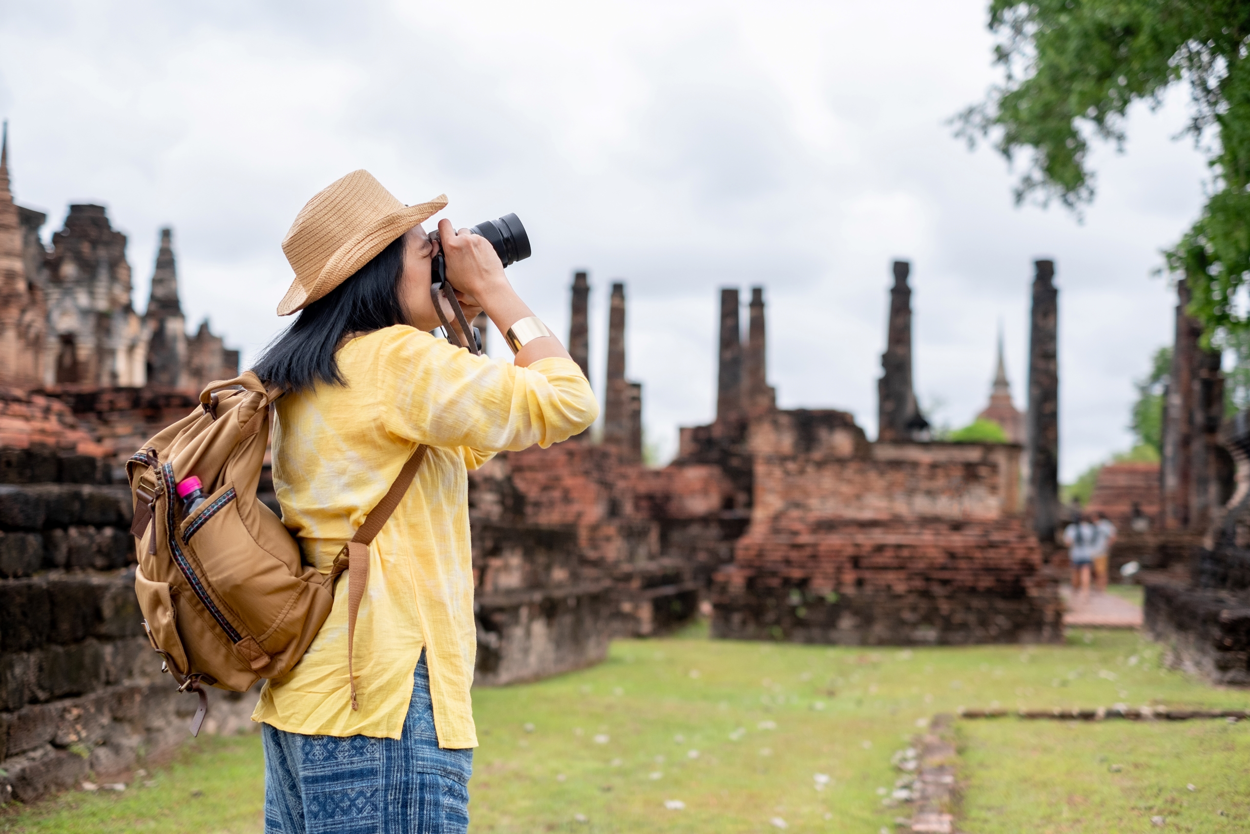 asian-tourist-woman-take-a-photo-of-ancient-of-pag-2023-11-27-05-14-17-utc1