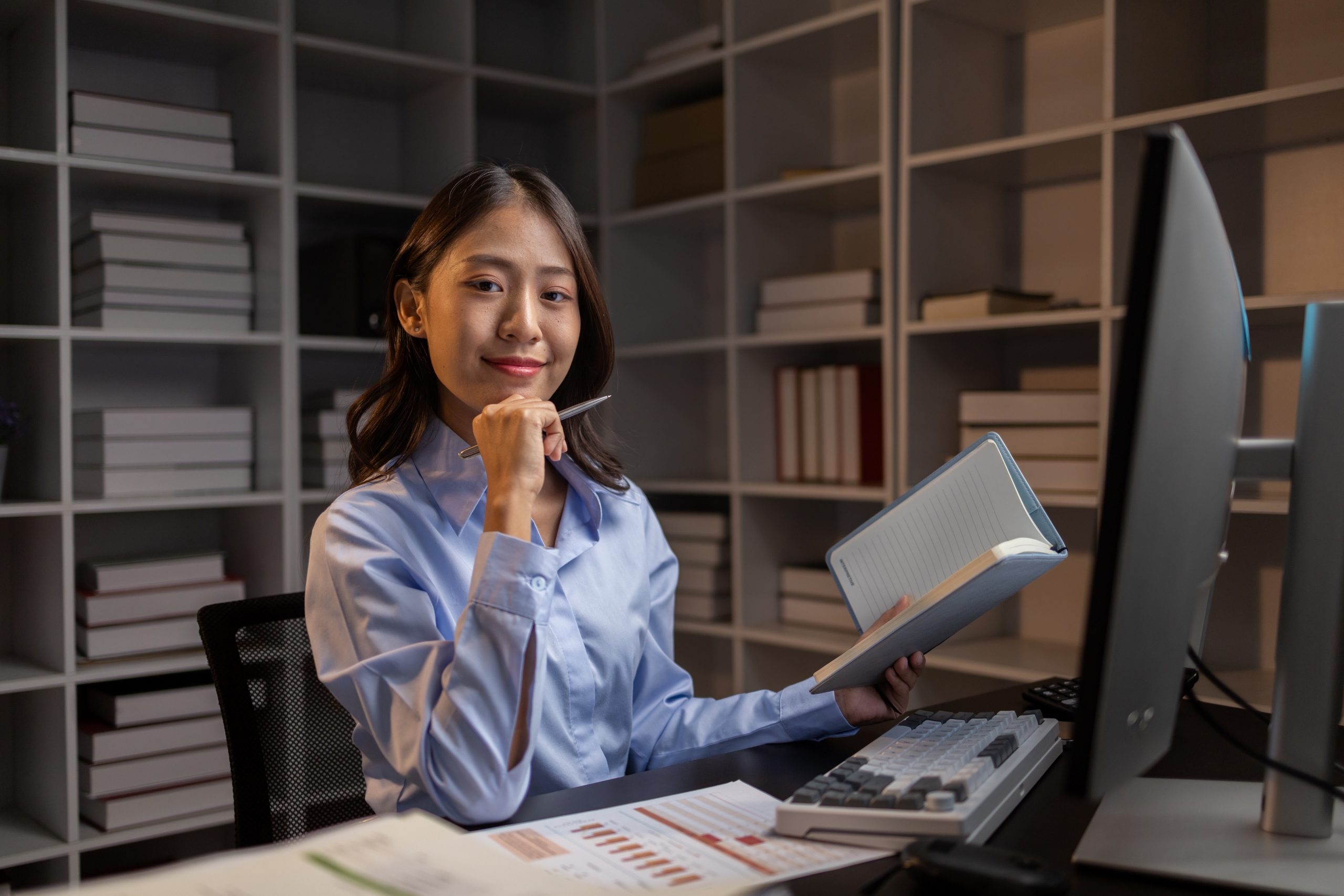 asian-woman-sitting-in-the-office-working-overtime-2023-11-27-05-21-31-utc1
