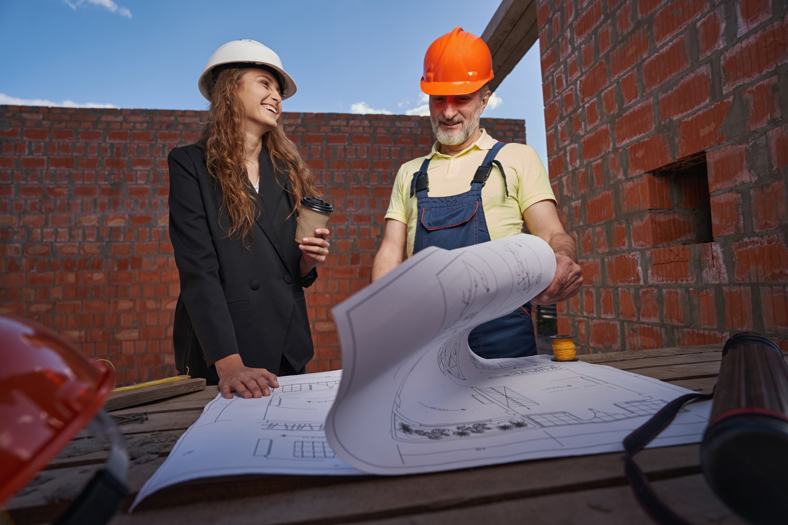 joyful-woman-smiling-at-worker-during-bluepring-ex-2023-11-27-05-10-52-utc1