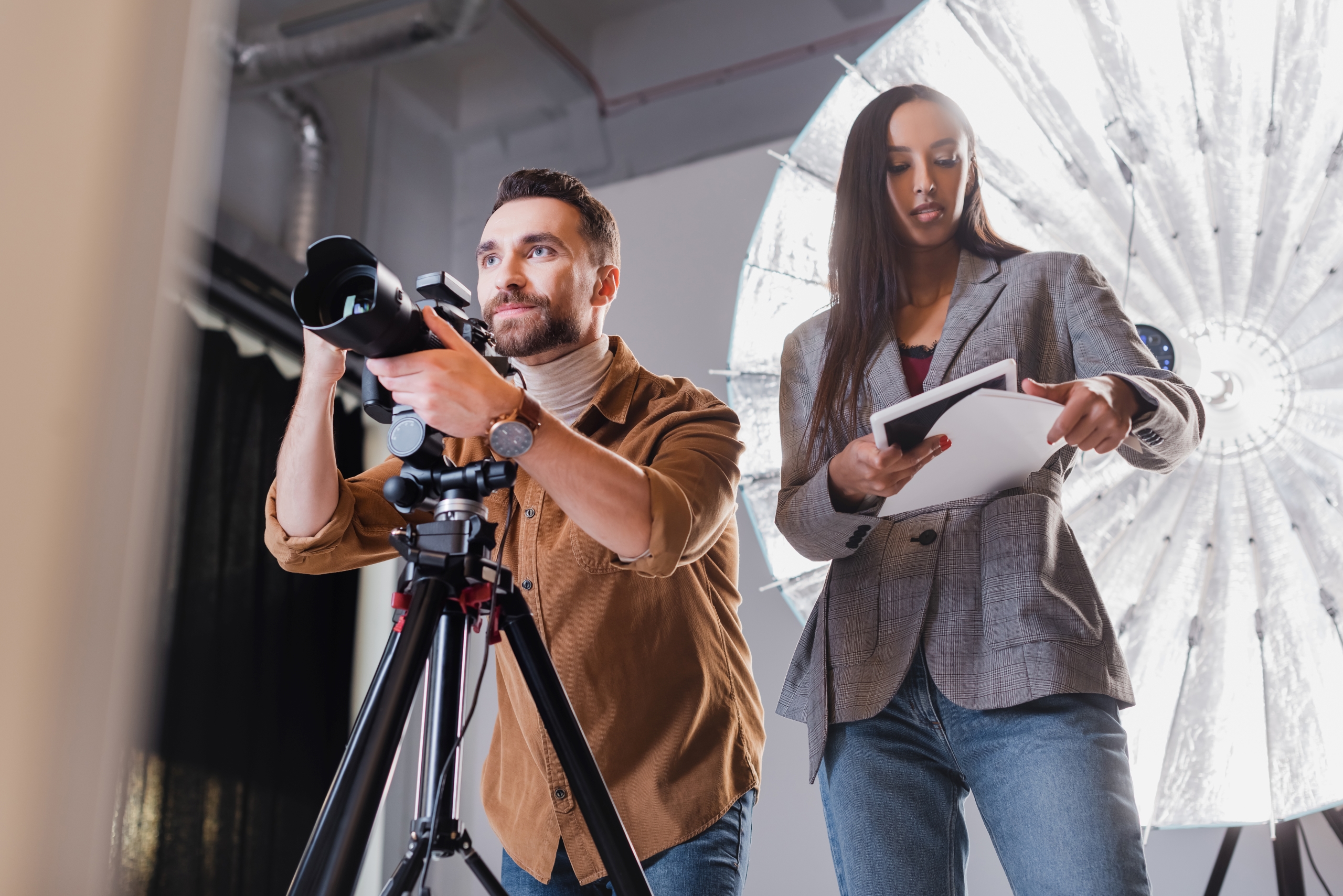 low-angle-view-of-photographer-taking-photo-and-pr-2023-11-27-04-58-15-utc1