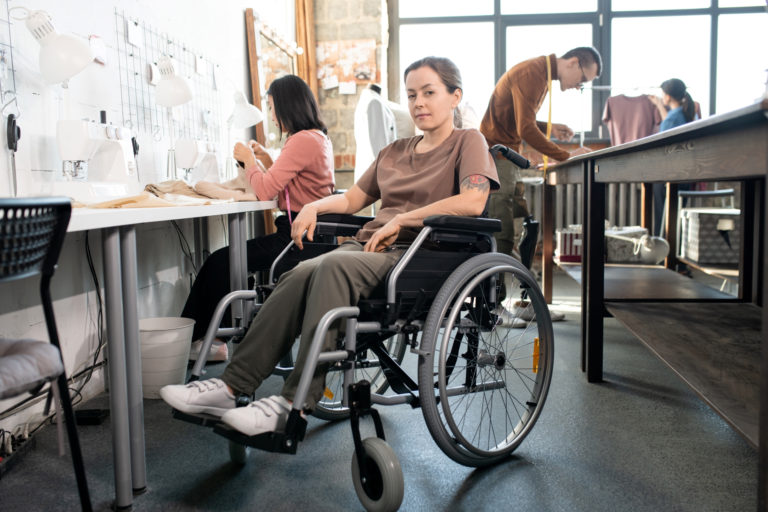 young-female-tailor-in-wheelchair-2023-11-27-04-57-46-utc1